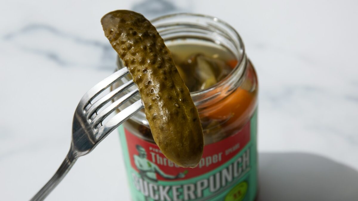 stainless steel fork on green labeled can