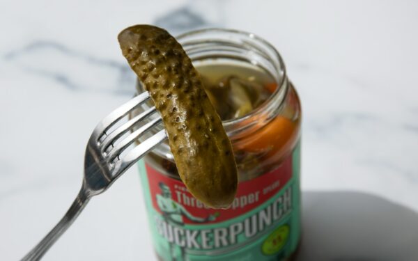 stainless steel fork on green labeled can