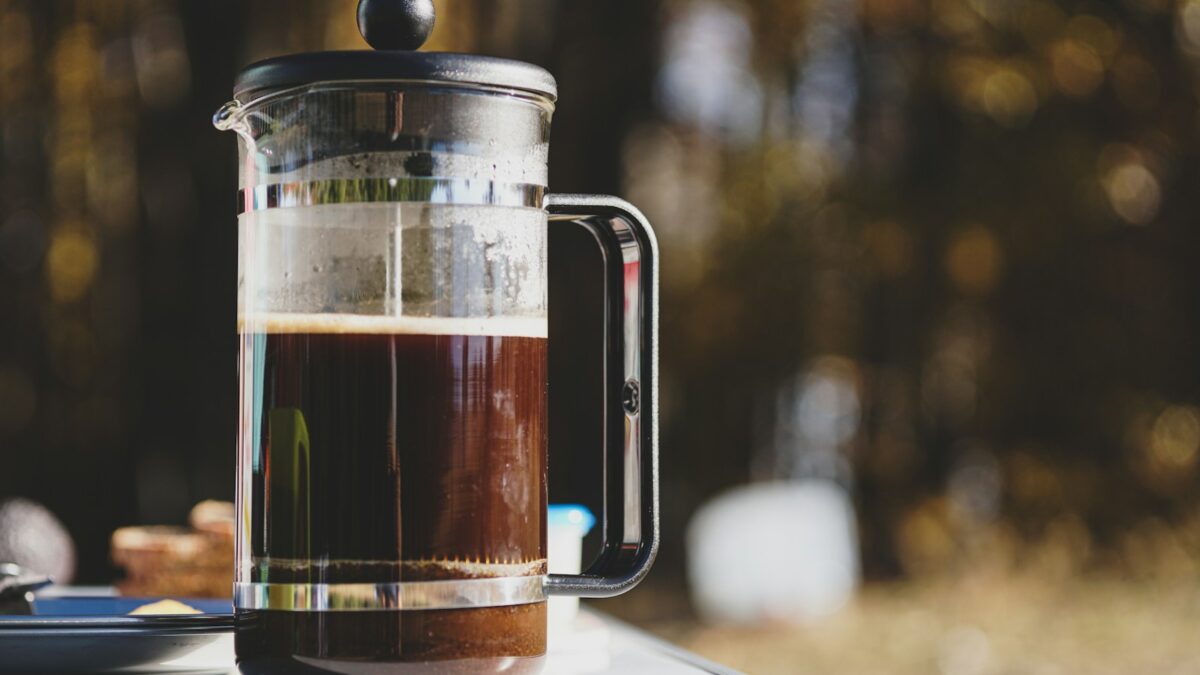 a pitcher of liquid sitting on top of a table