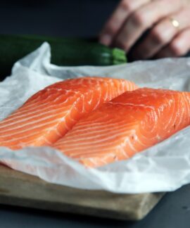 raw fish meat on brown chopping board