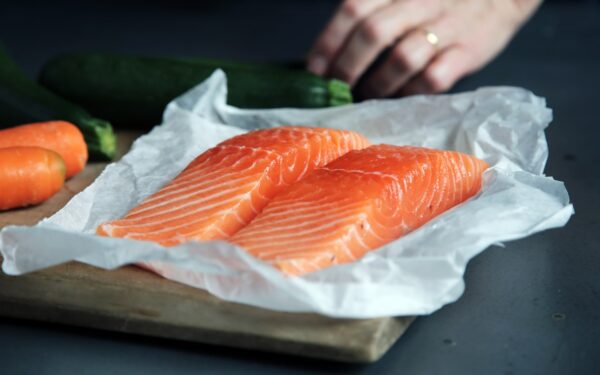raw fish meat on brown chopping board