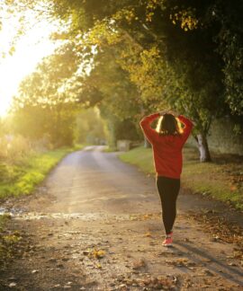 woman walking on pathway during daytime