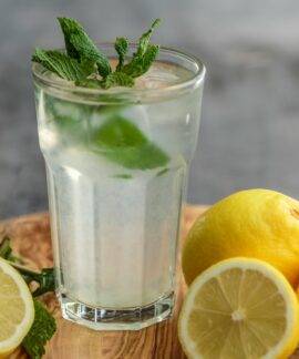 lime juice on drinking glass beside sliced limes