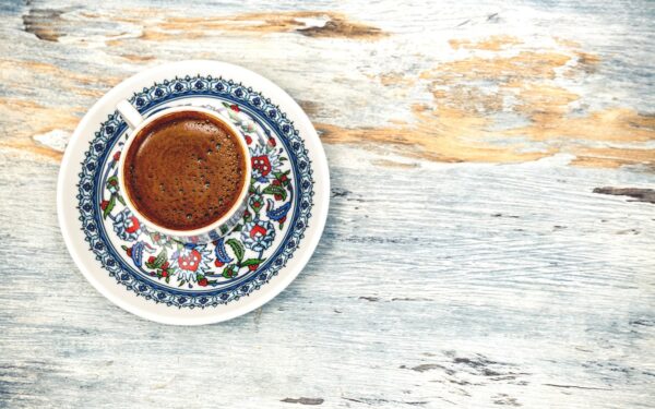 flat lay photography of cup filled with coffee