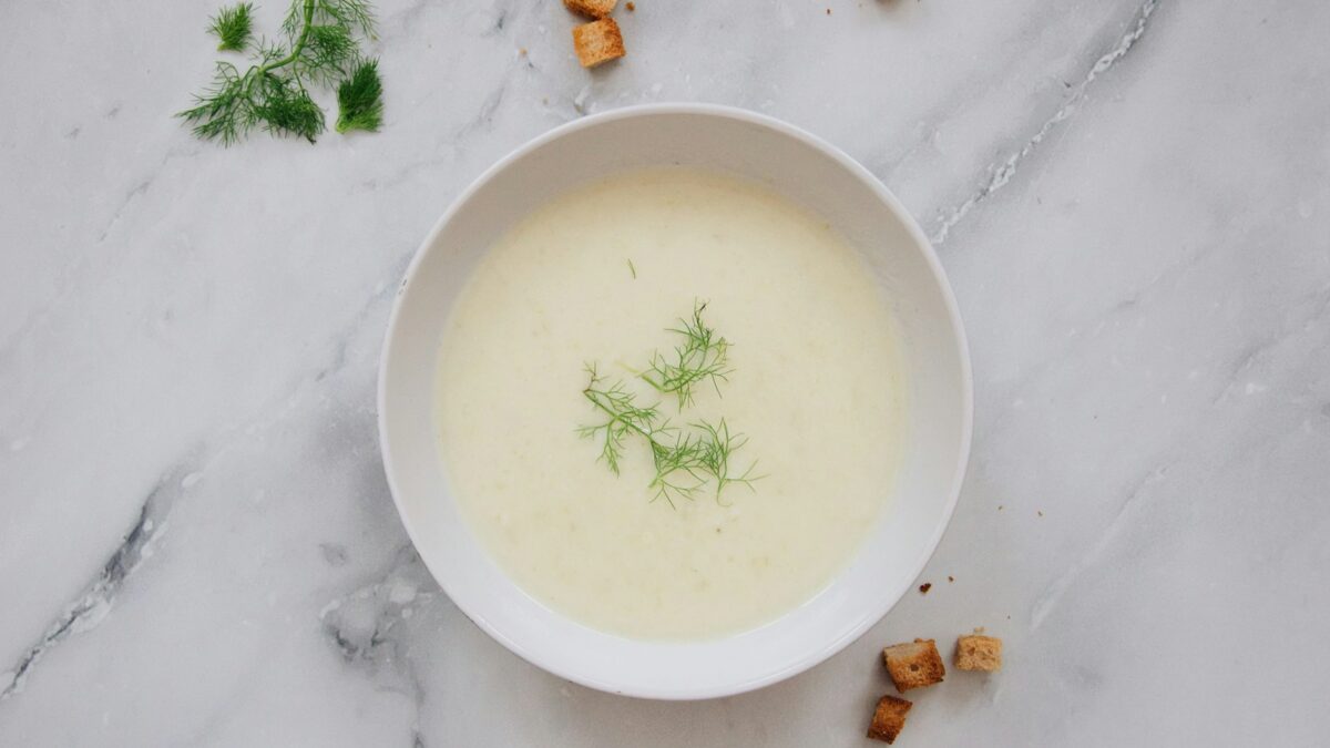 white ceramic bowl with green liquid