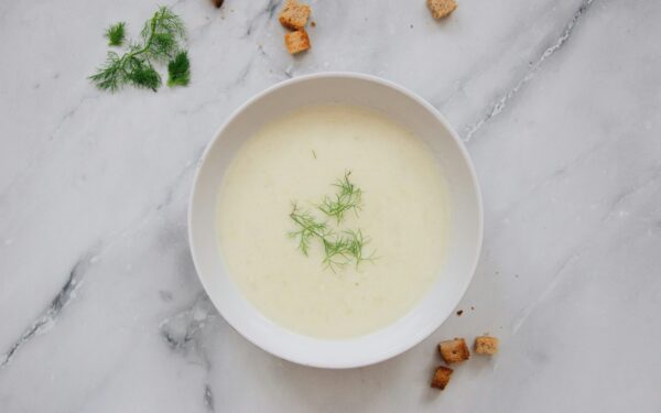 white ceramic bowl with green liquid