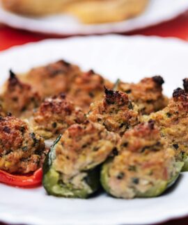 a plate of stuffed peppers on a table