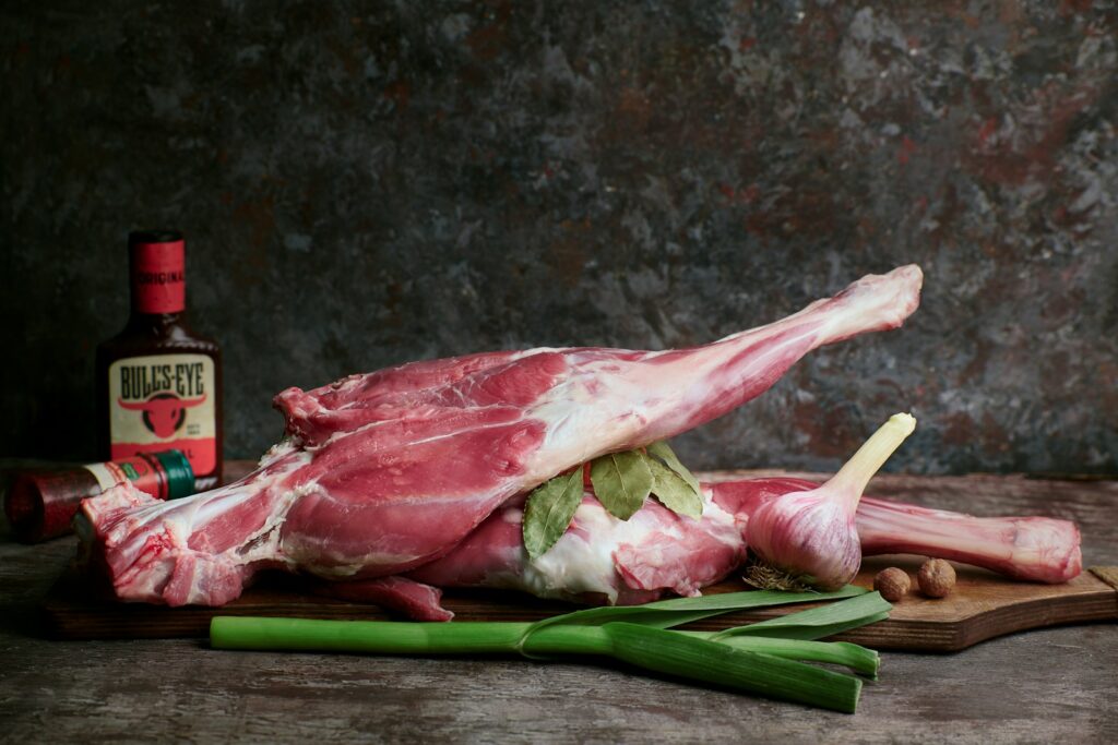 a piece of meat sitting on top of a cutting board