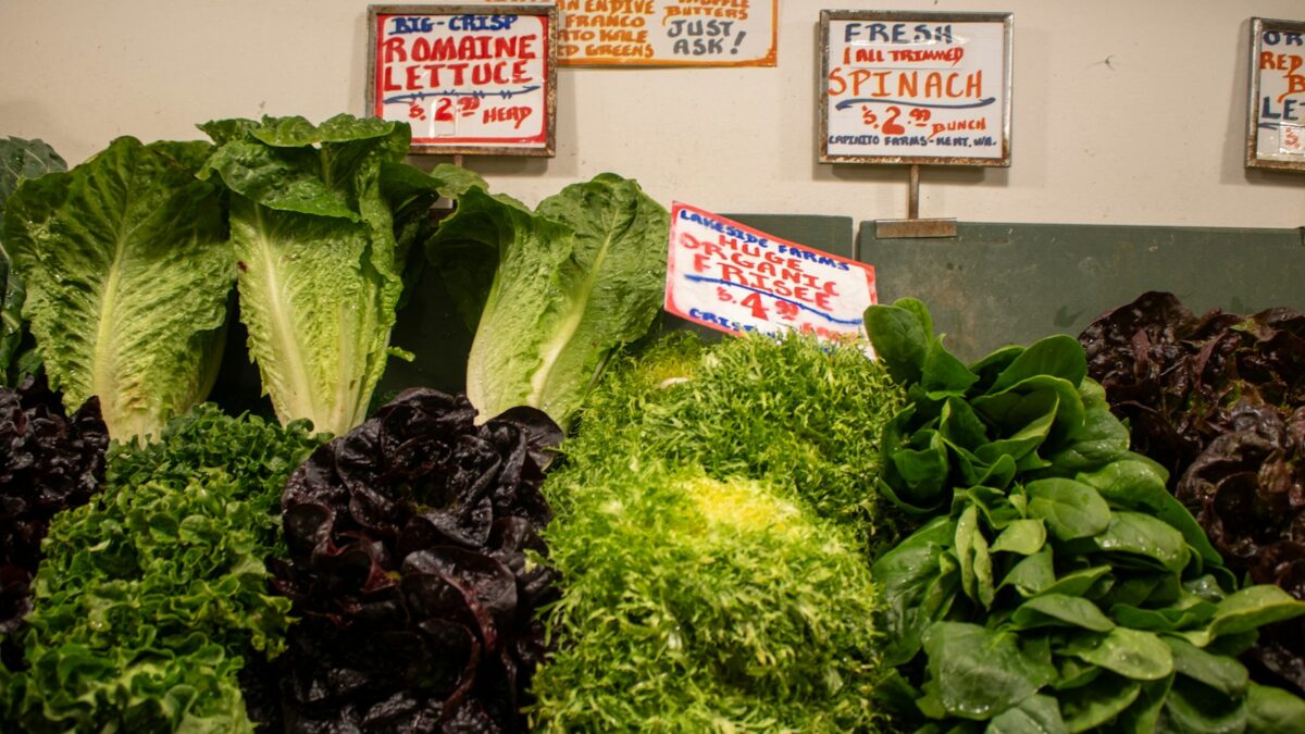 Fresh and colorful greens and lettuce for sale.