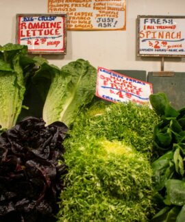 Fresh and colorful greens and lettuce for sale.