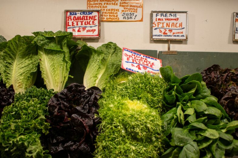 Fresh and colorful greens and lettuce for sale.