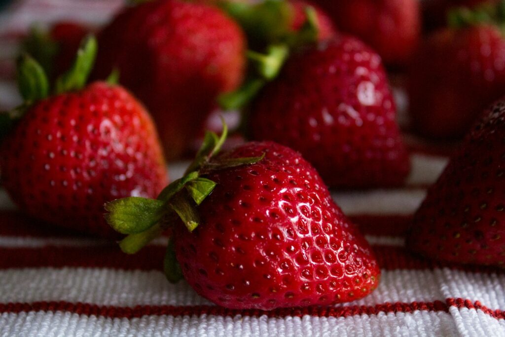 A close up of a bunch of strawberries on a table