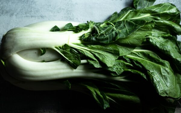 green vegetable on white ceramic plate