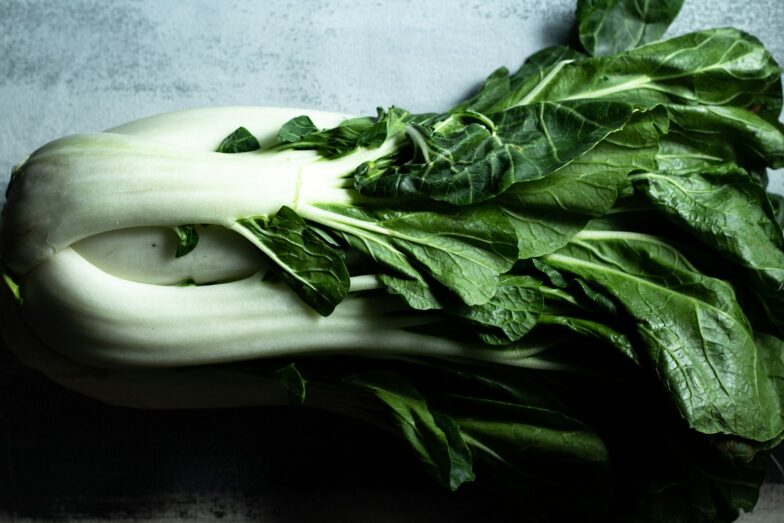 green vegetable on white ceramic plate