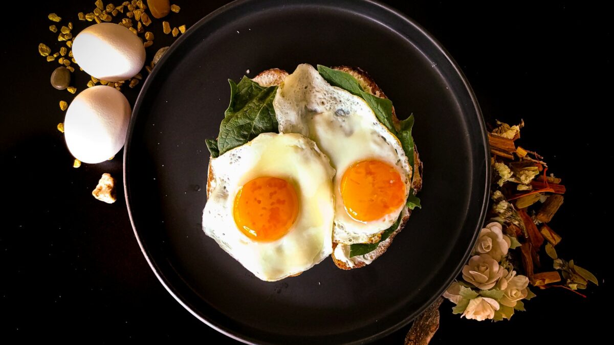 sunny side up egg on black ceramic plate