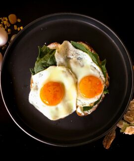 sunny side up egg on black ceramic plate