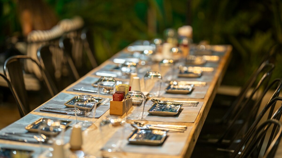clear glass bottle on brown wooden table