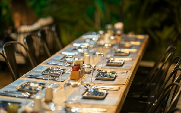 clear glass bottle on brown wooden table