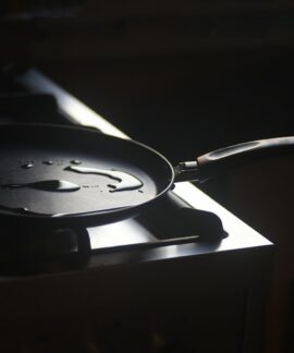 a frying pan sitting on top of a stove
