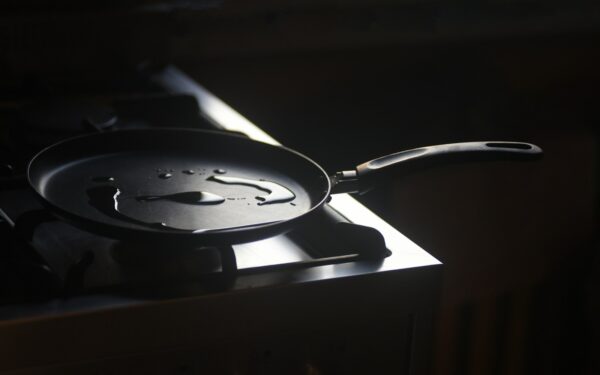 a frying pan sitting on top of a stove