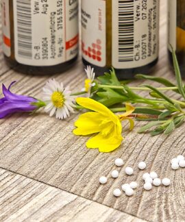 A bottle of medicine sitting on top of a wooden table